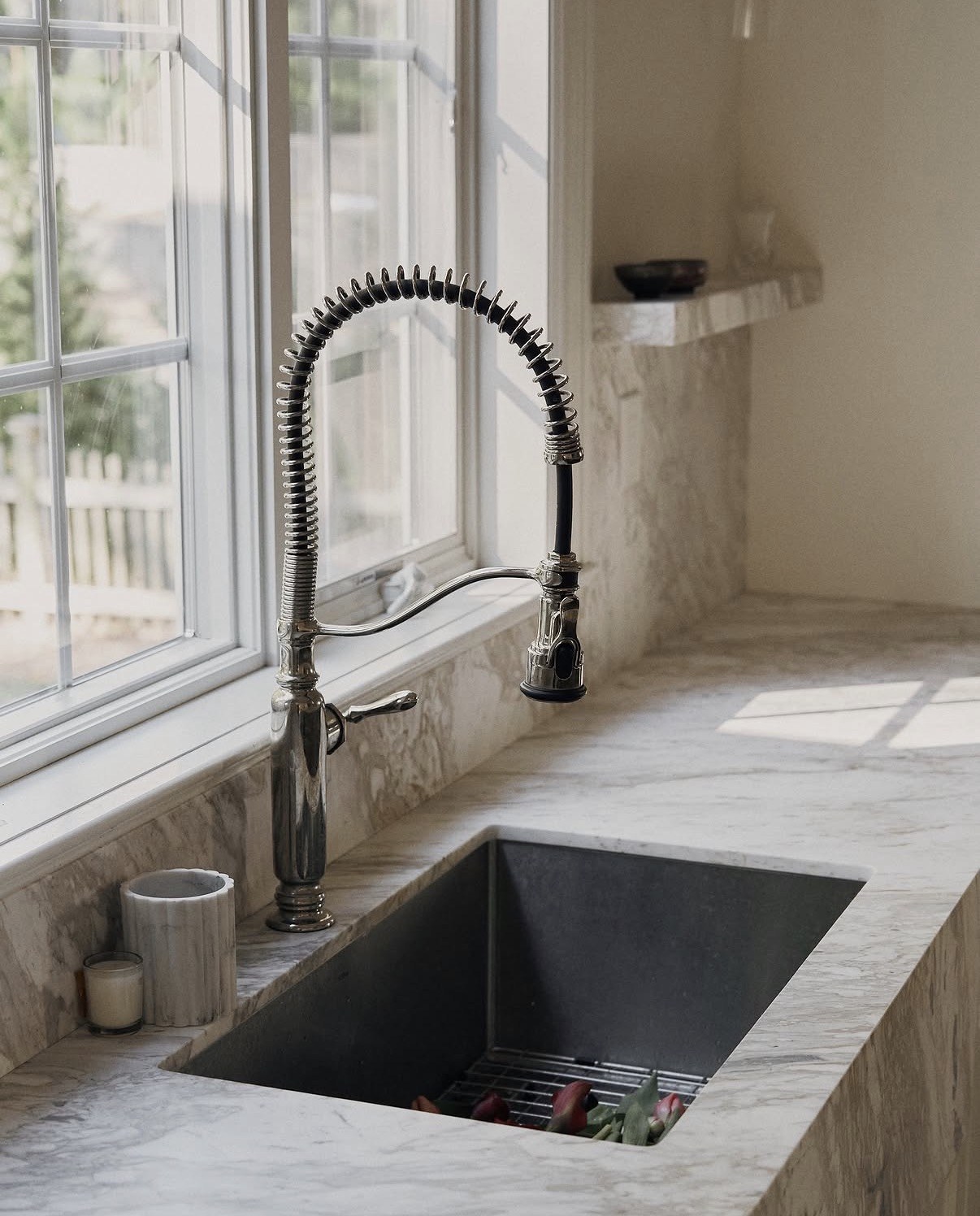Close-up of the undermount sink, faucet and stone countertop
